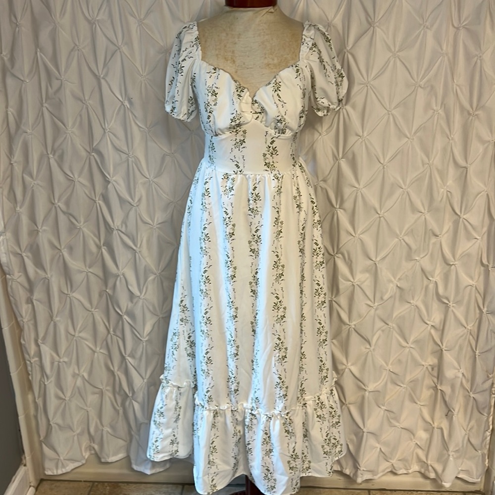 White dress with green print of flowers